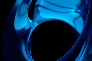 A close up of a blue object on a black background